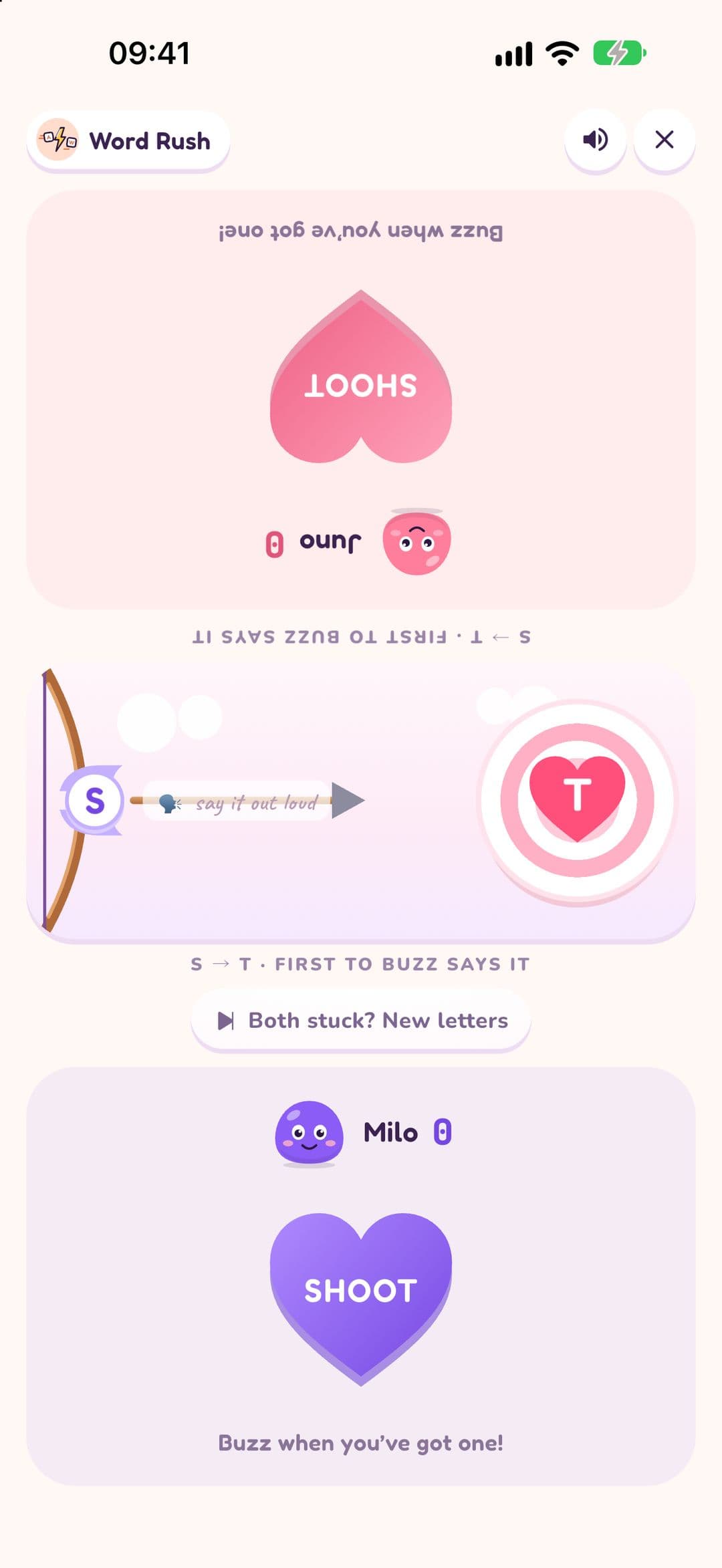 Word Rush mid-round on one phone: S on the arrow, T on the heart target, "S to T, first to buzz says it", a Both stuck? New letters button, and a SHOOT buzzer for each player.